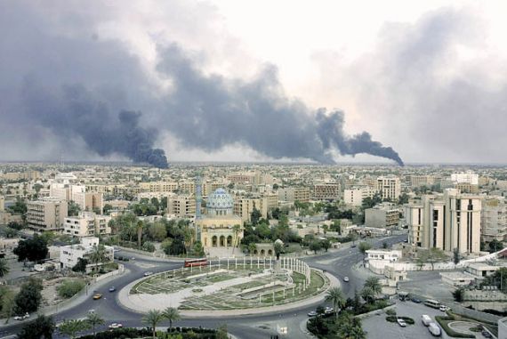 Huge columns of smoke can be seen above the southern horizon of Baghdad Saturday, March 22, 2003.. Sporadic explosions were heard in the capital Saturday. (AP Photo/Jerome Delay)